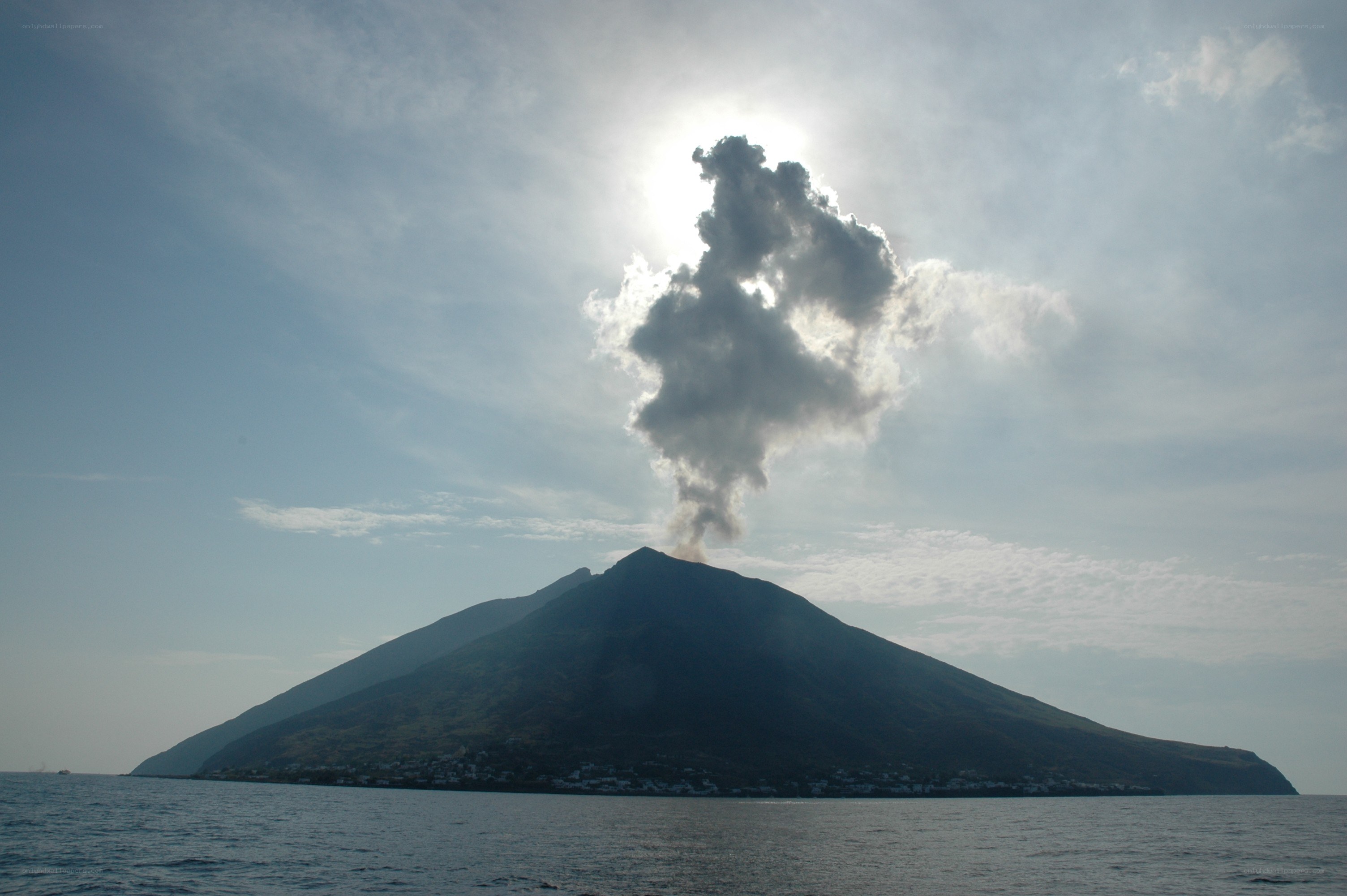 Volcano erupting on an island