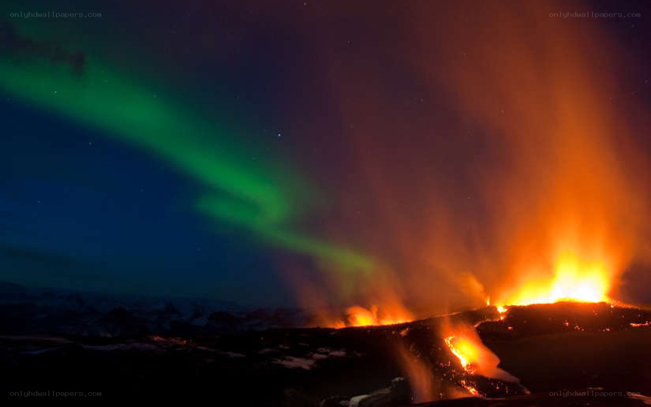Volcano erupting under aurora