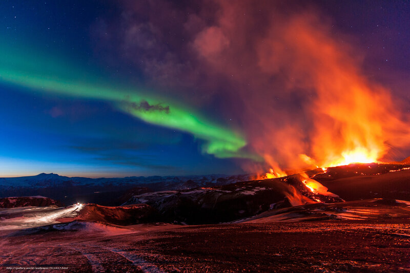 Volcano erupting under aurora