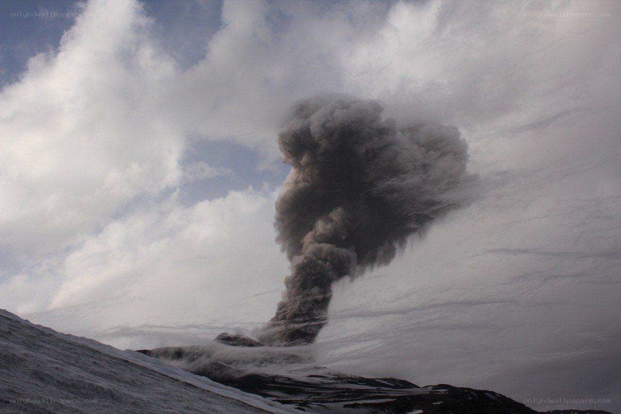 Volcano erupting with ash cloud