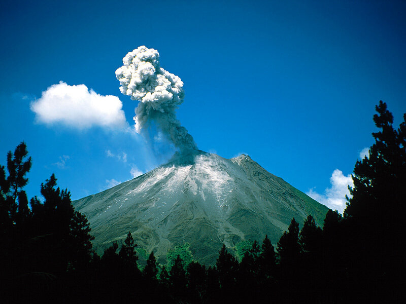 Volcano erupting with ash cloud
