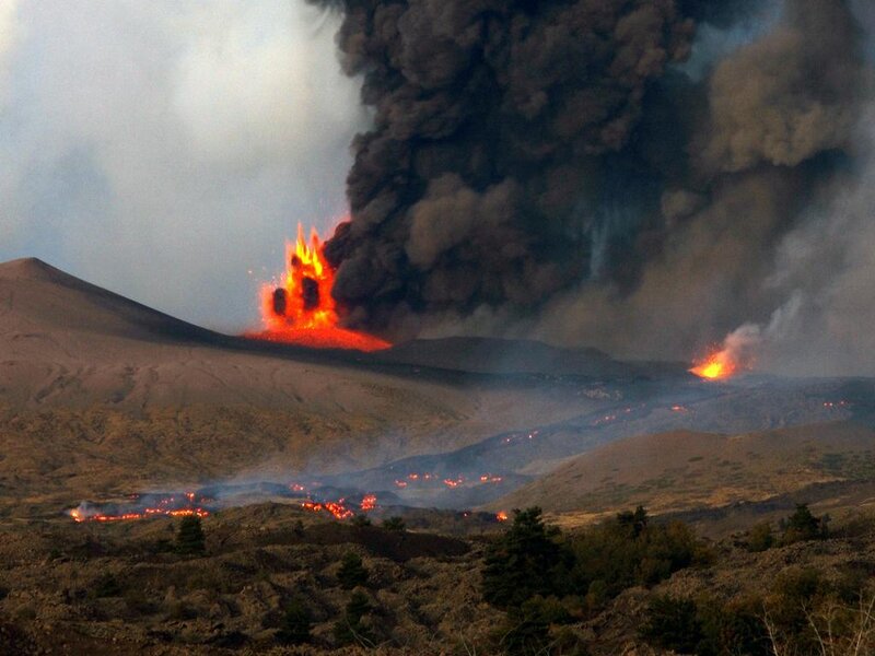 Volcano erupting with lava and ash