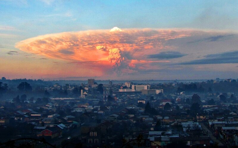 Volcano eruption over city