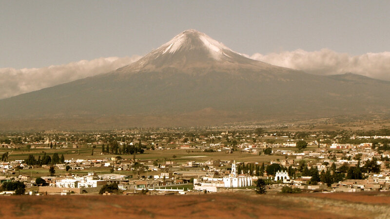 Volcano overlooking a town
