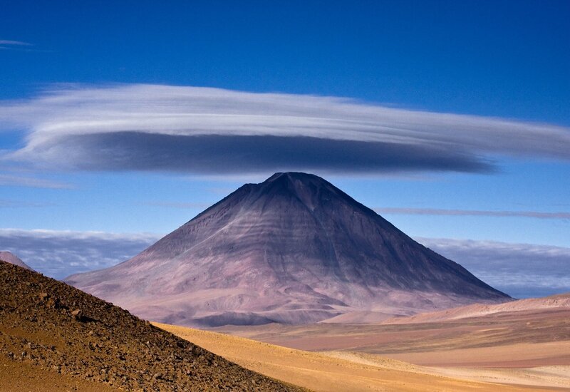 Volcano with lenticular cloud