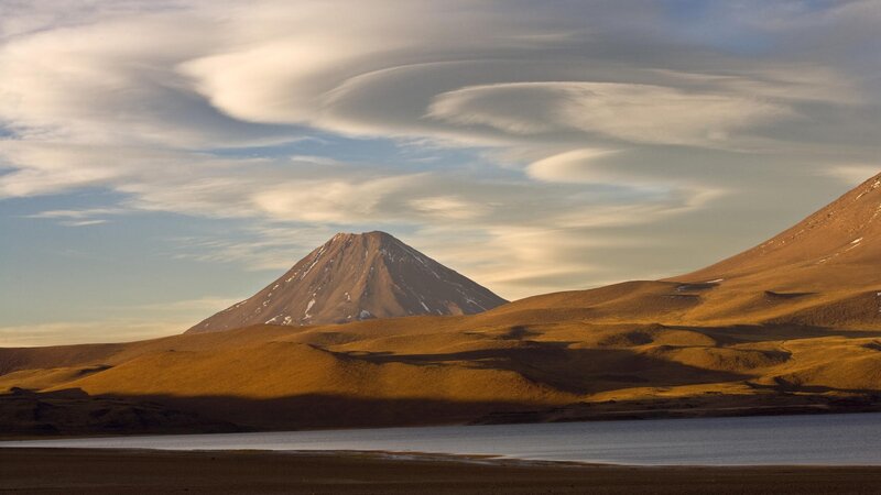 Volcano with lenticular clouds
