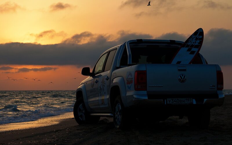 Volkswagen Amarok on beach at sunset