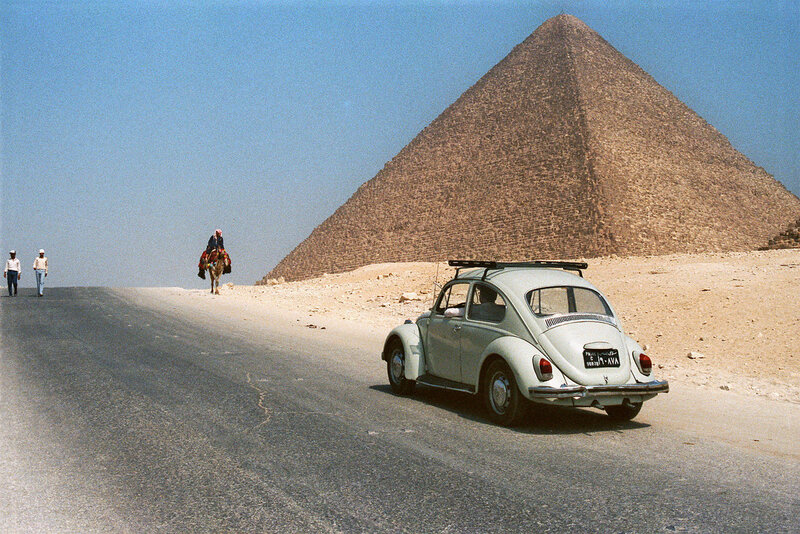 Volkswagen Beetle near a pyramid