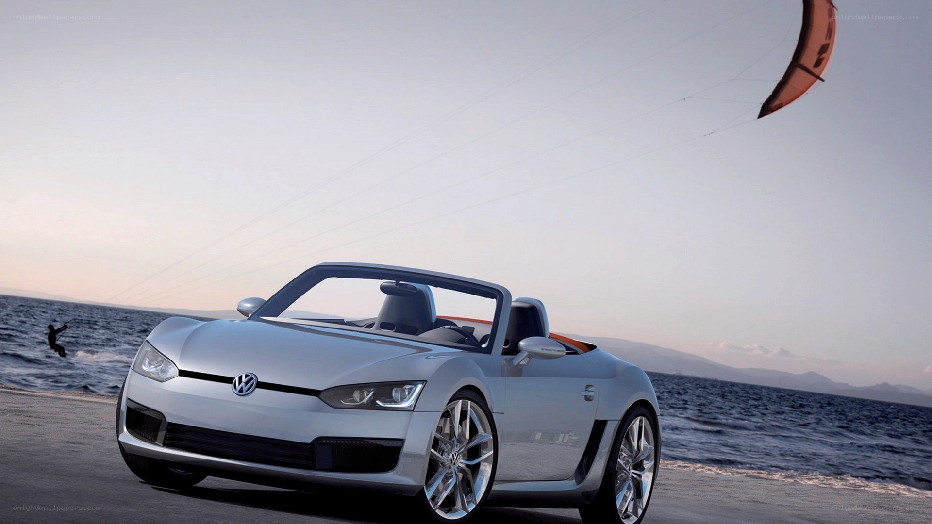 Volkswagen convertible on beach