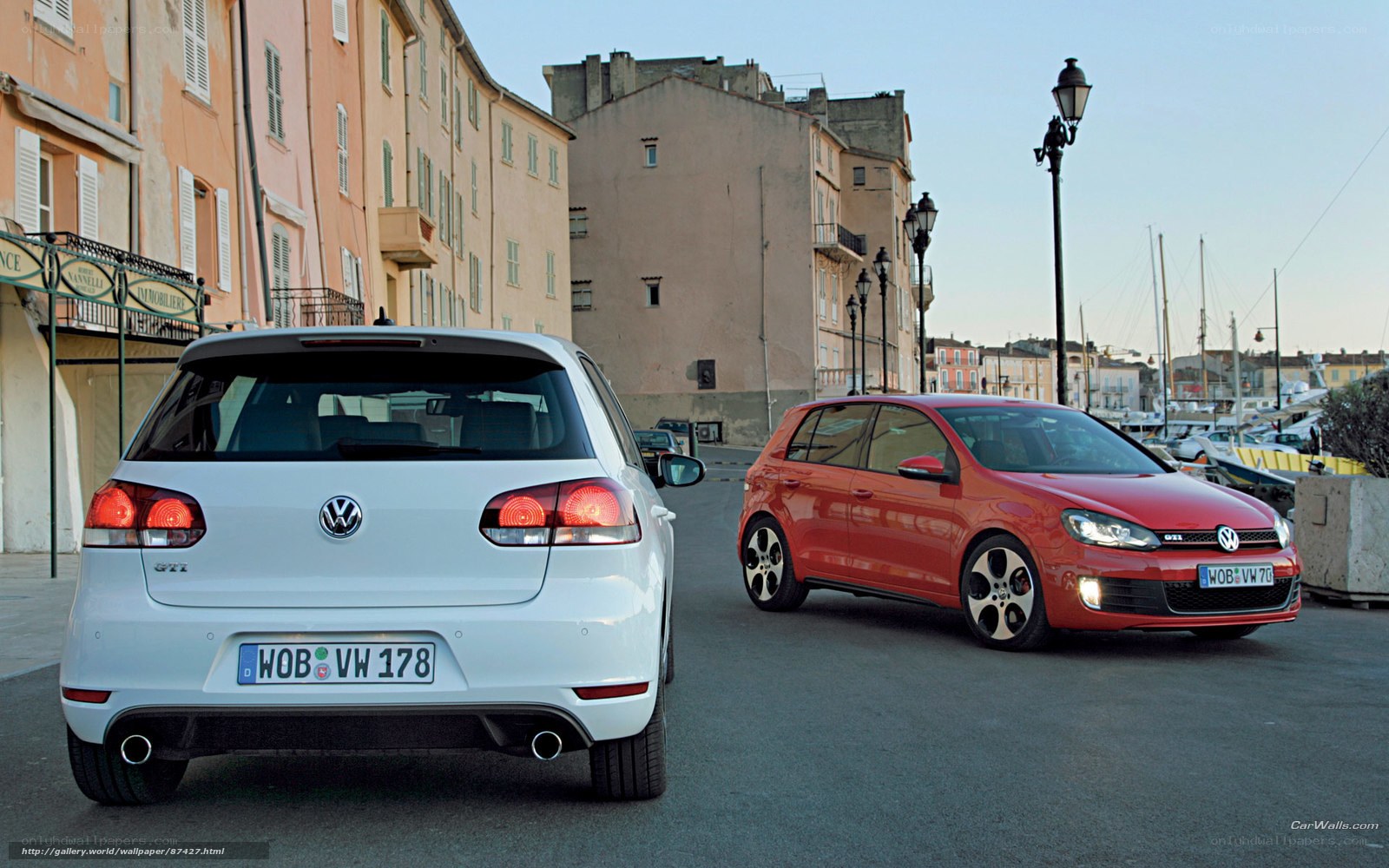 Volkswagen GTI cars in a coastal town