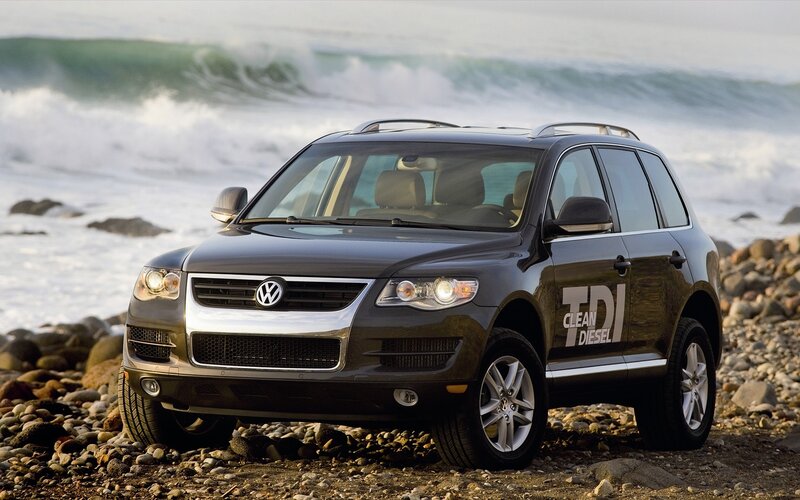 Volkswagen Touareg on rocky beach