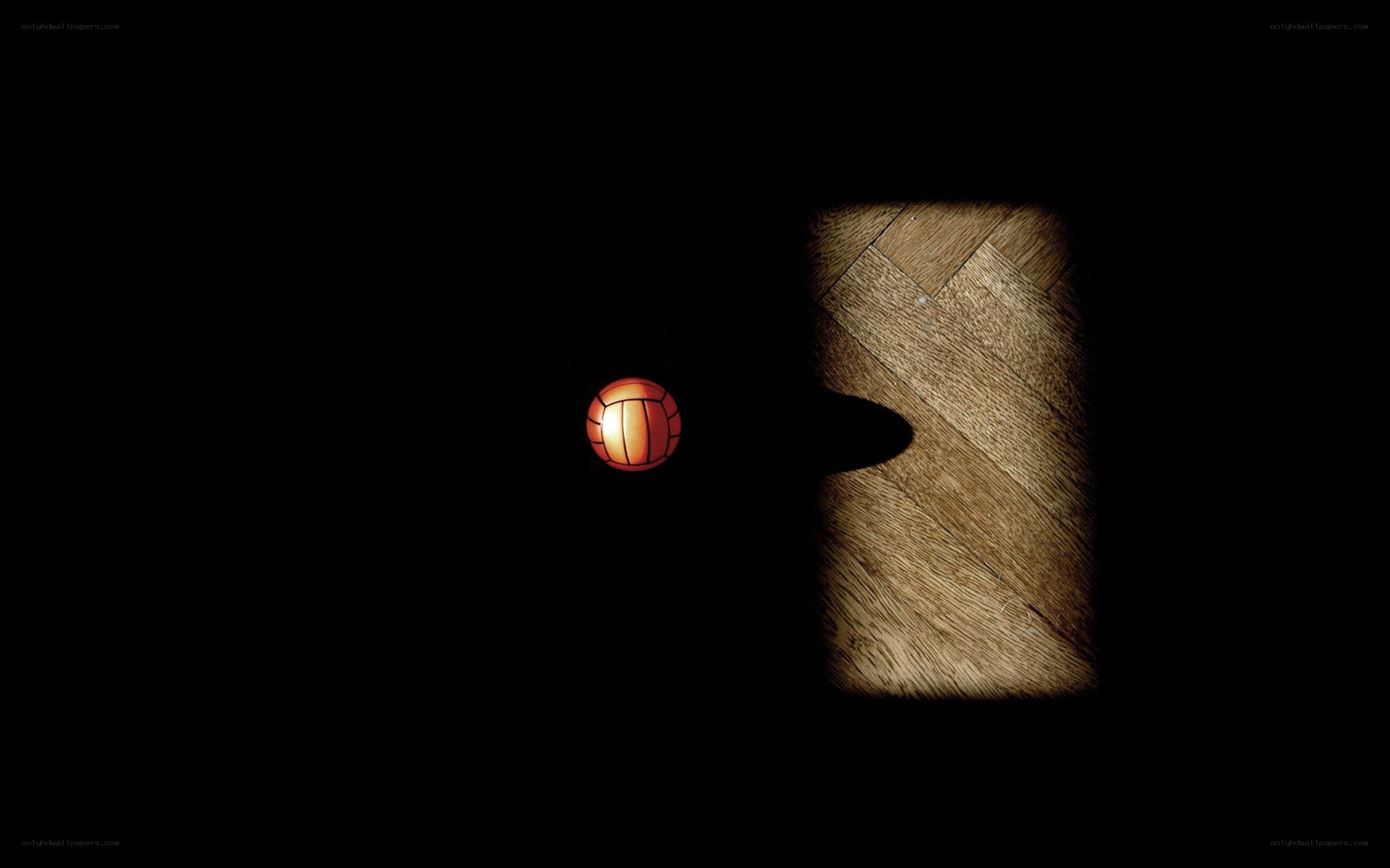 Volleyball on dark floor
