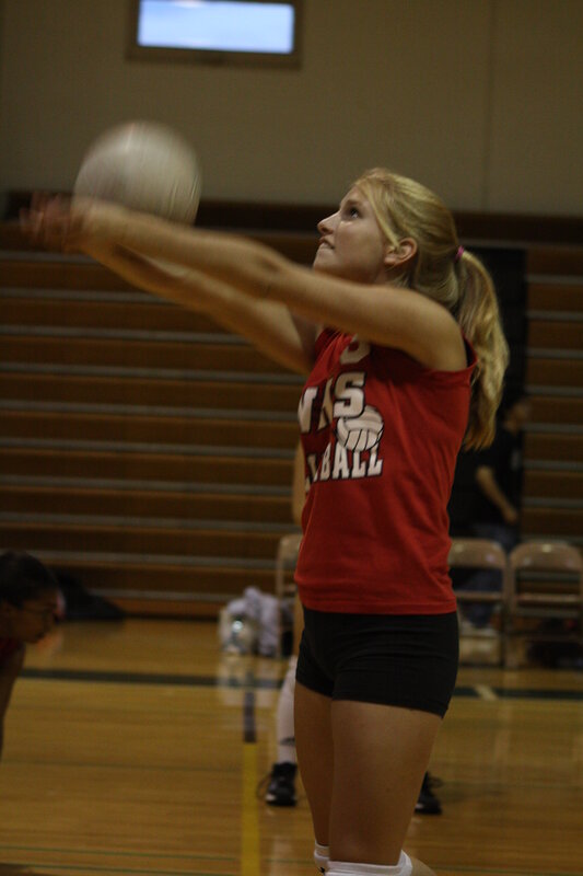 Volleyball player serving