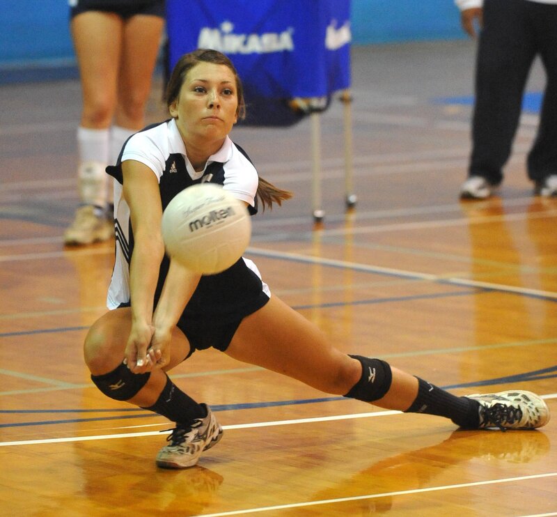 Volleyball player setting ball