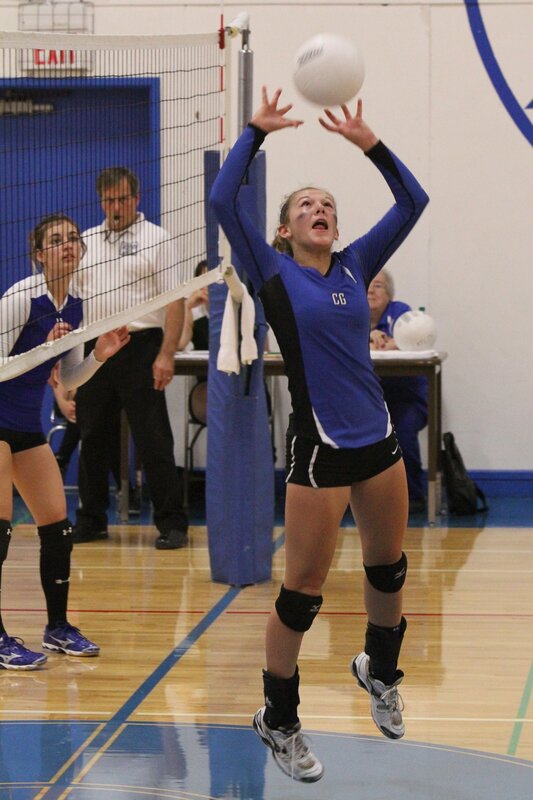 Volleyball player setting the ball