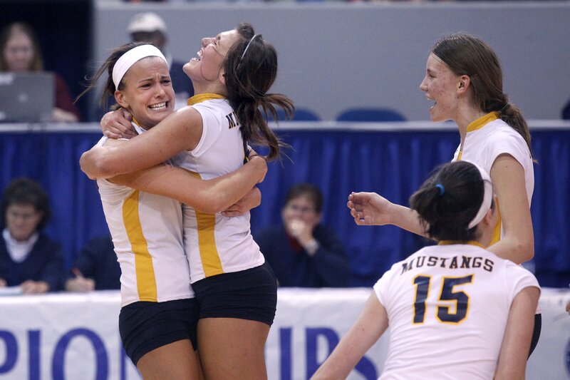 Volleyball players celebrate win