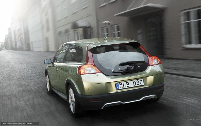 Volvo C30 driving on city street