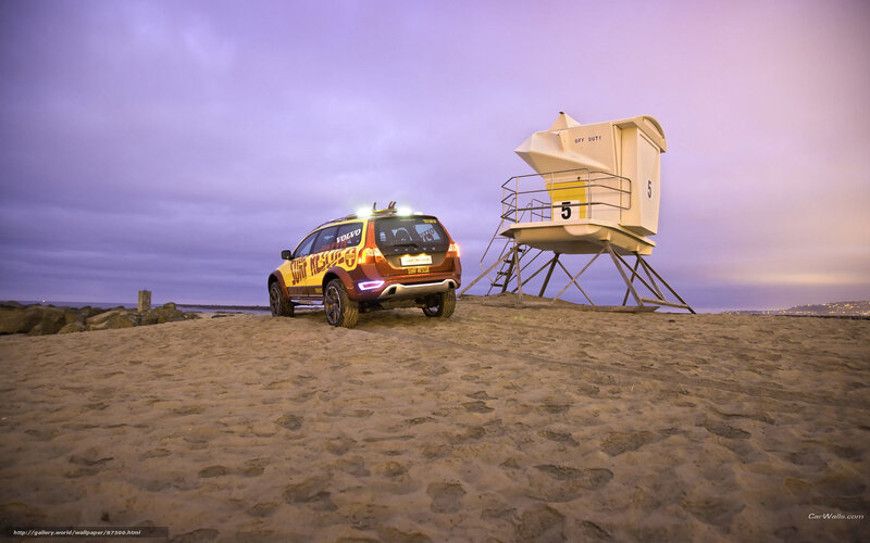 Volvo car on beach at dusk