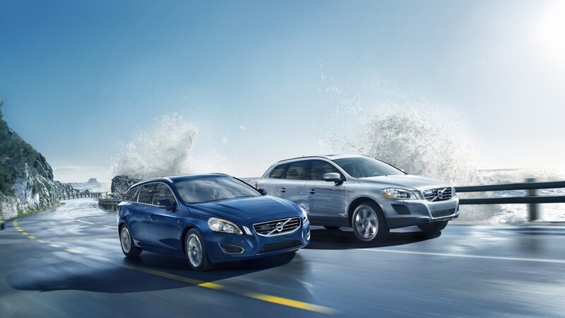 Volvo cars on coastal road