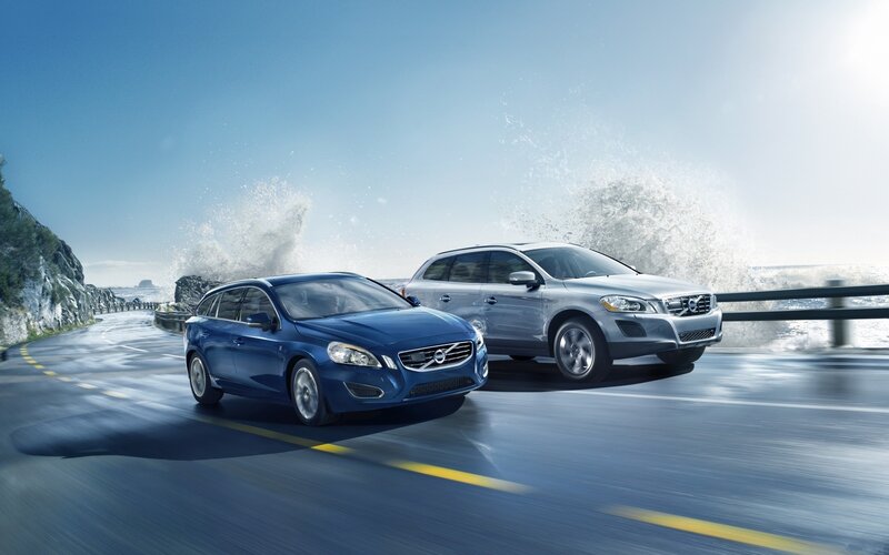 Volvo cars on coastal road