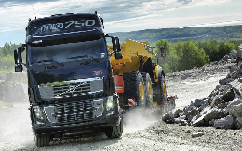 Volvo FH16 truck transporting machinery