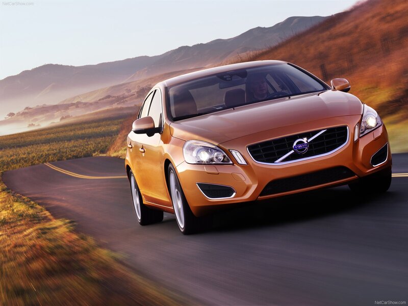 Volvo S60 driving on a scenic road