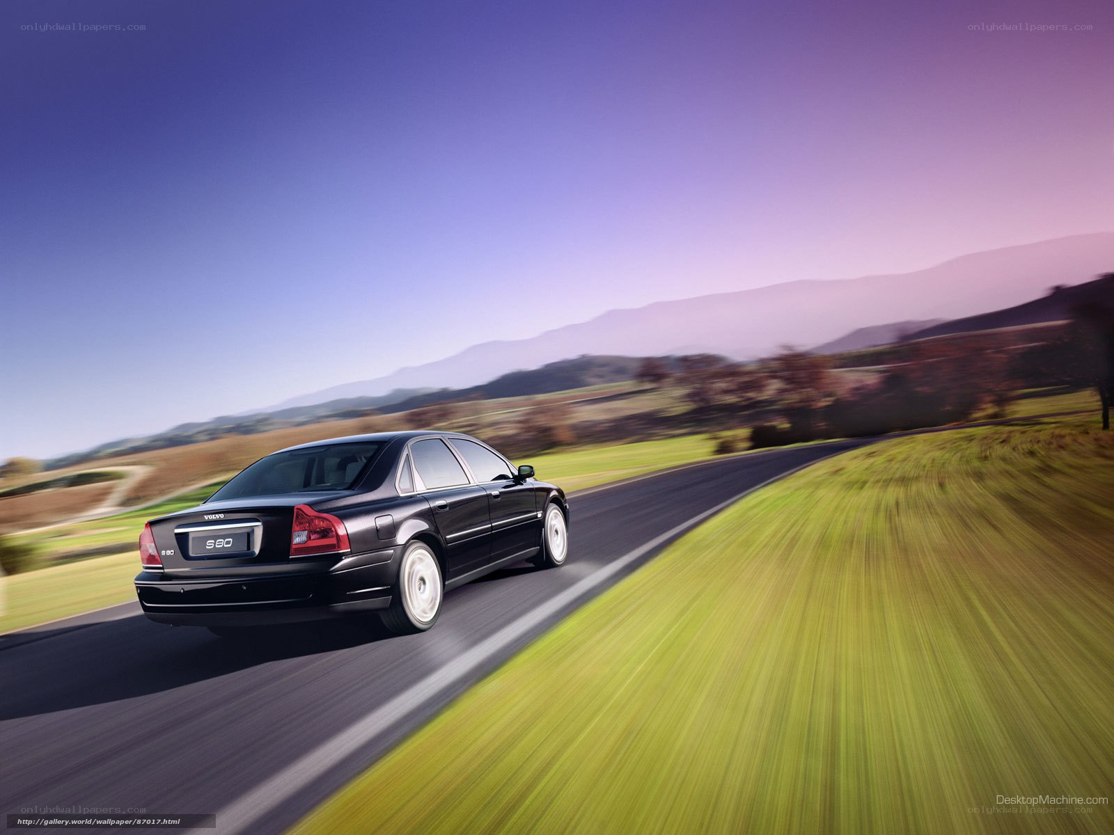 Volvo S80 driving on country road