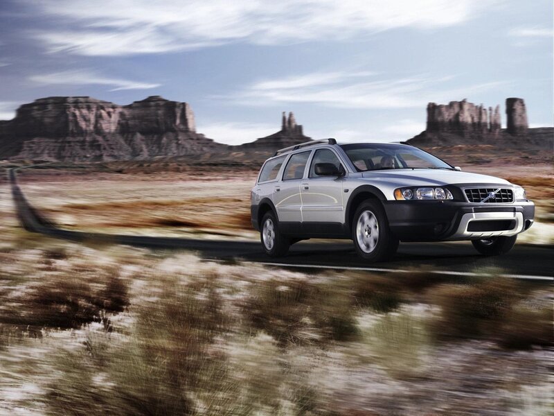 Volvo station wagon on desert road