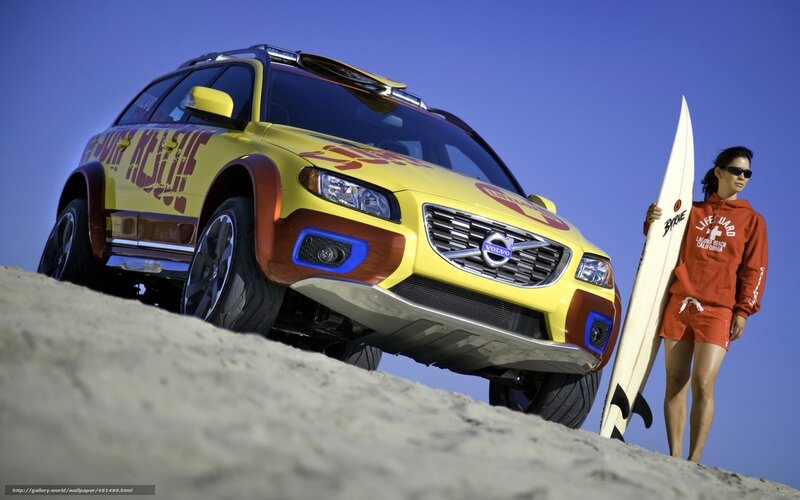 Volvo SUV on beach with lifeguard