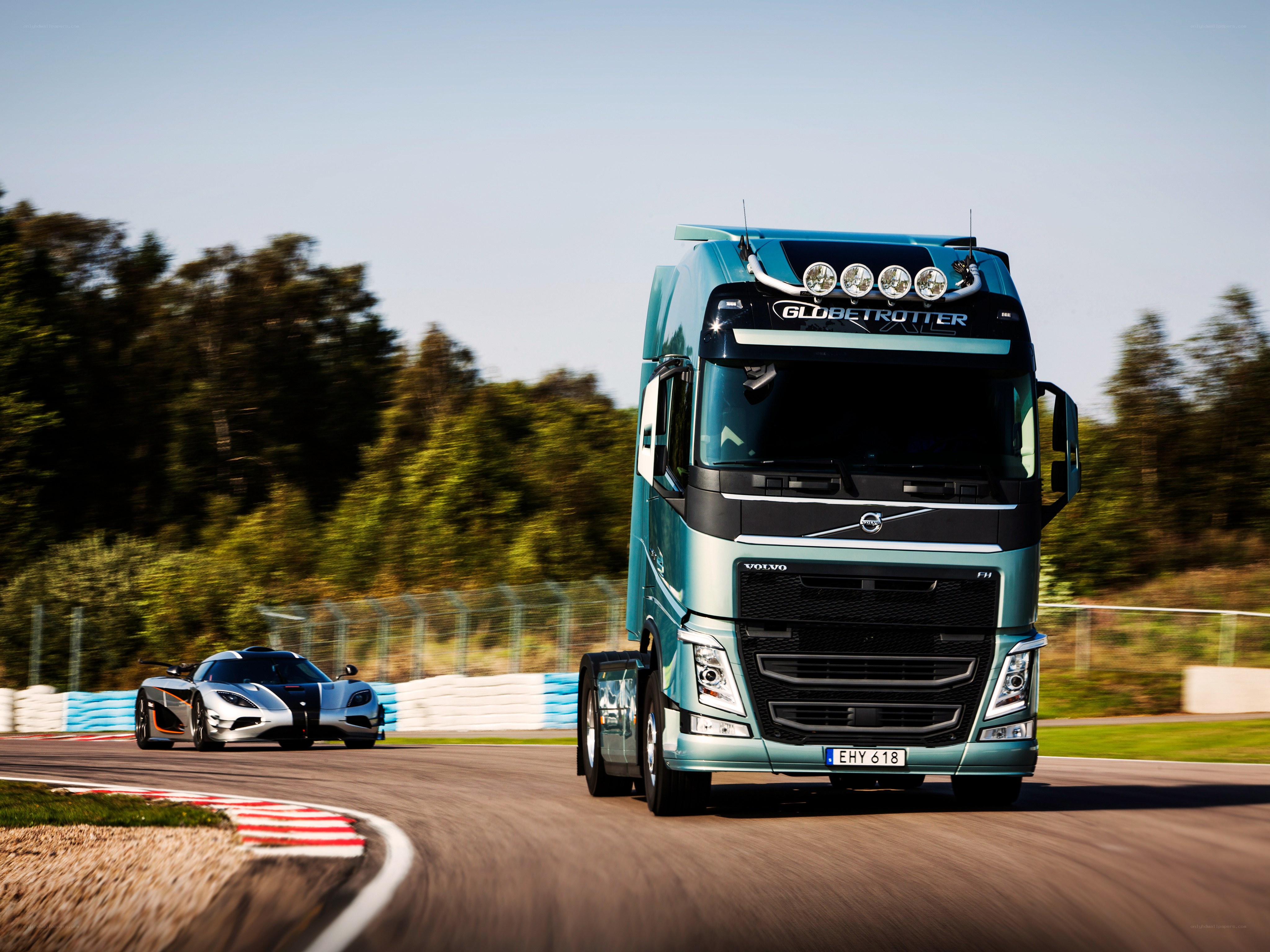 Volvo truck and Koenigsegg on track