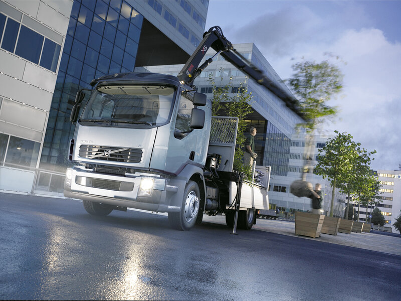 Volvo truck with crane in city