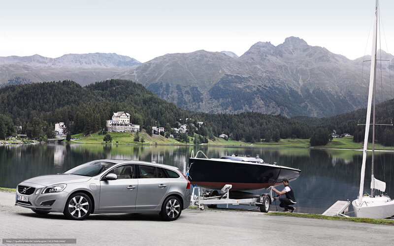 Volvo V60 with boat on lake