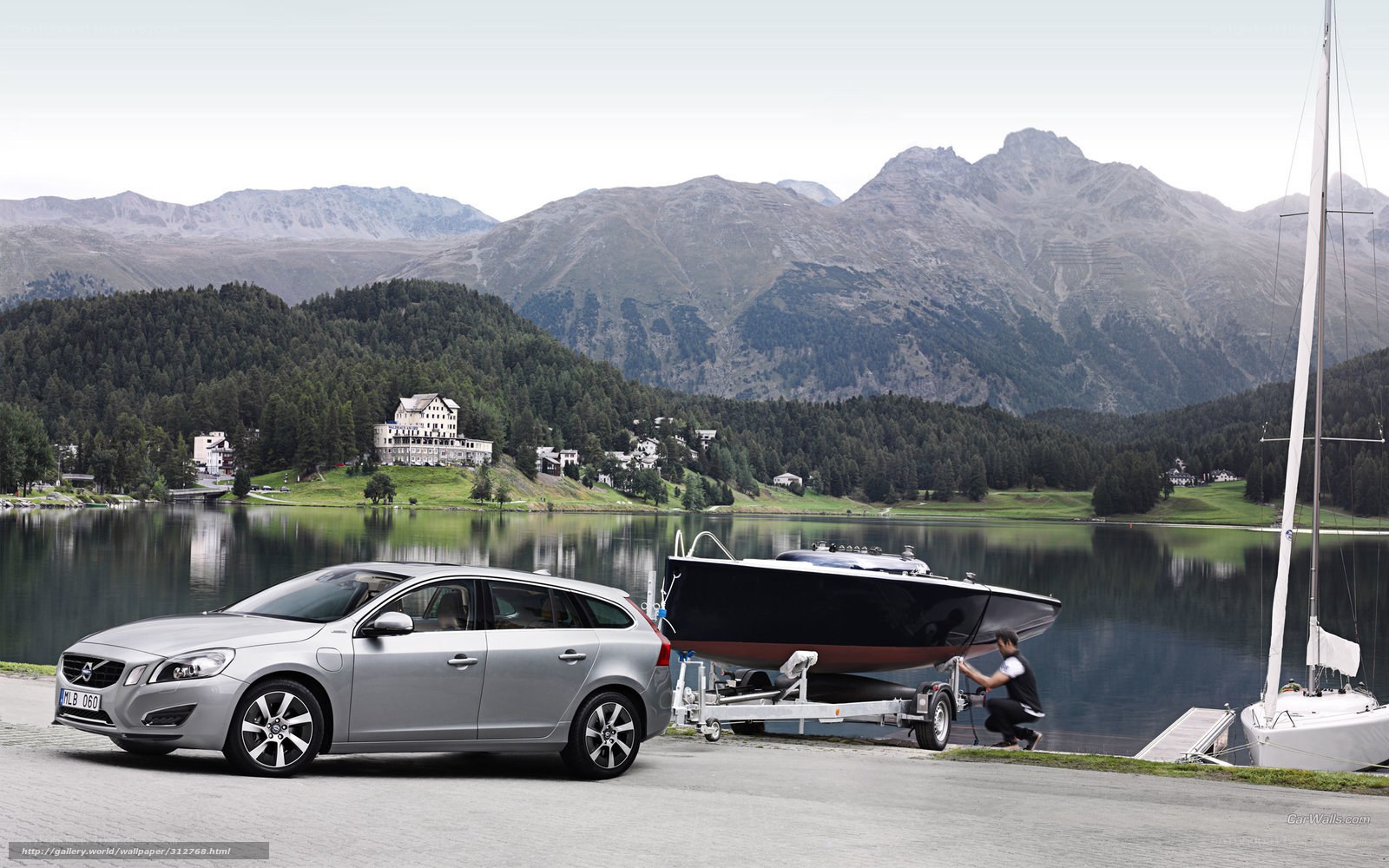 Volvo V60 with boat on lake