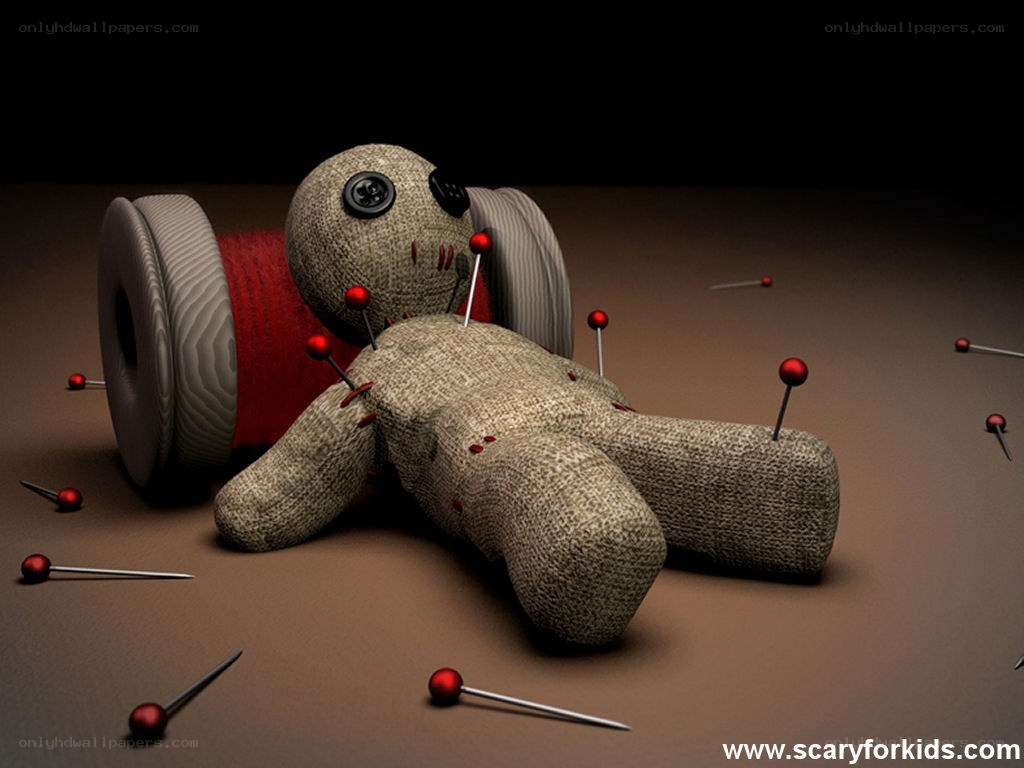 Voodoo doll with pins