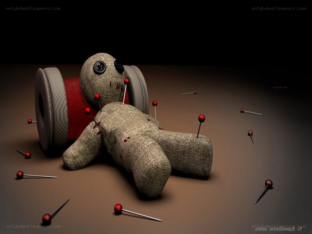 Voodoo doll with pins