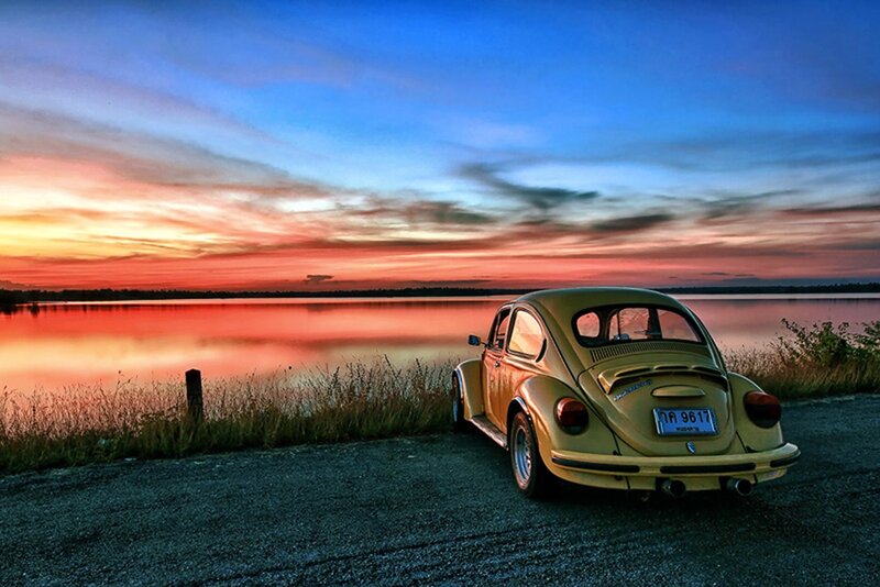 VW Beetle at sunset by the lake