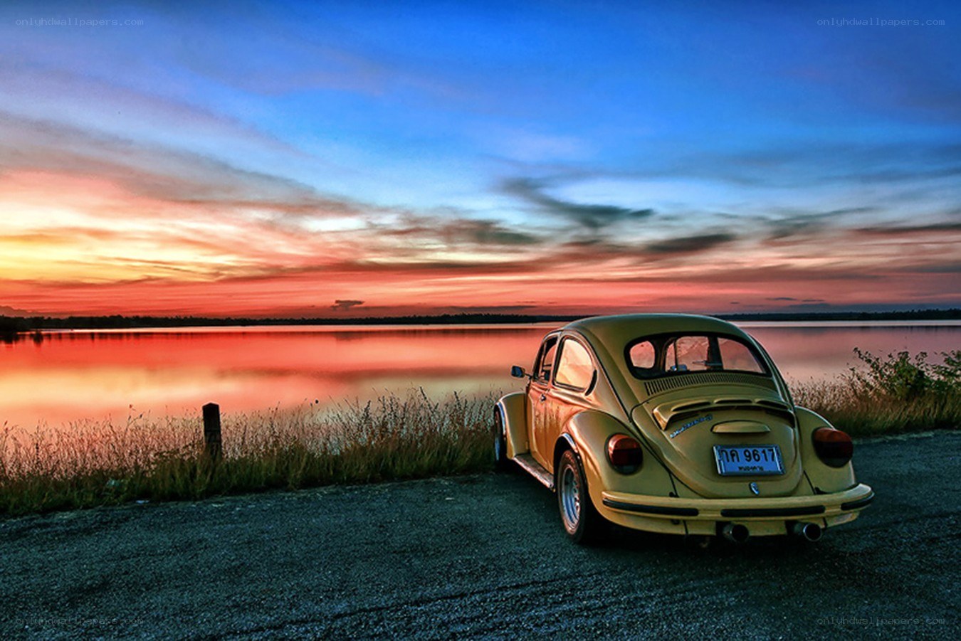 VW Beetle at sunset by the lake