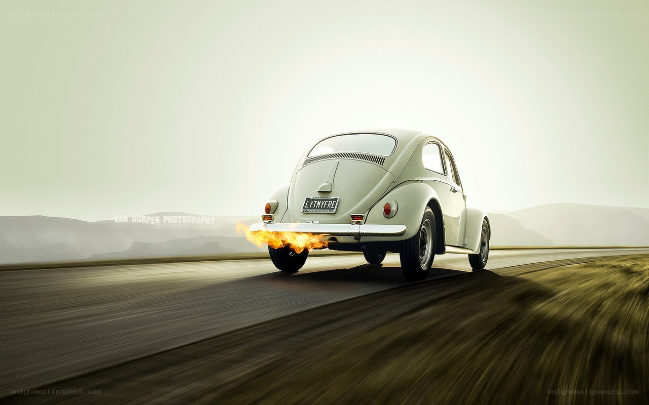 VW Beetle with flames on road
