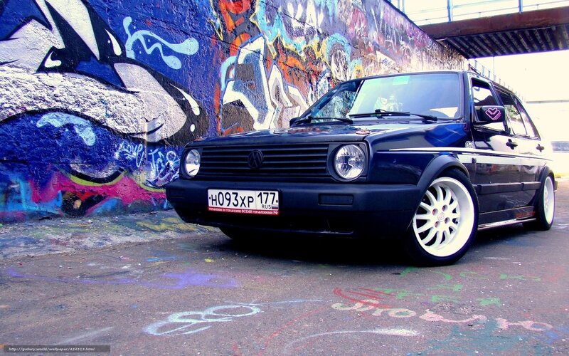 VW Golf with graffiti background