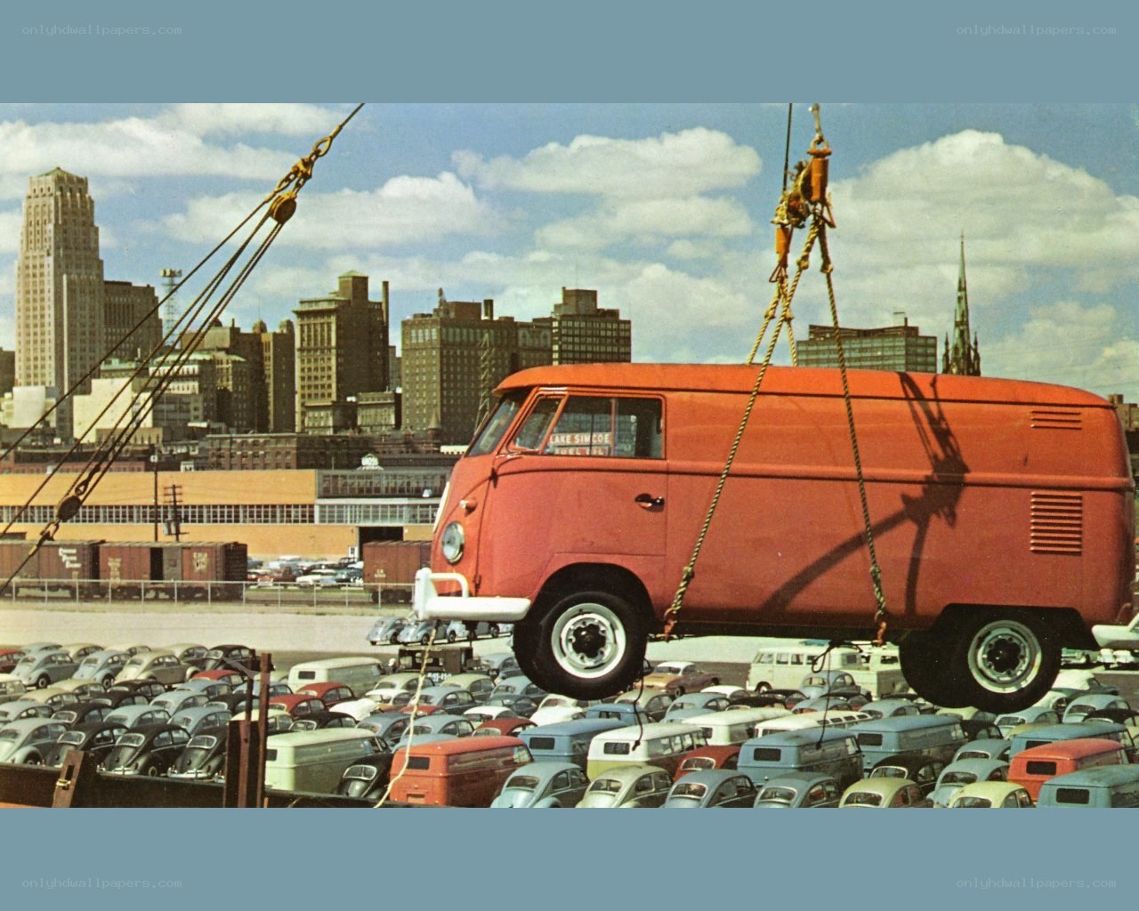 VW van being lifted by crane