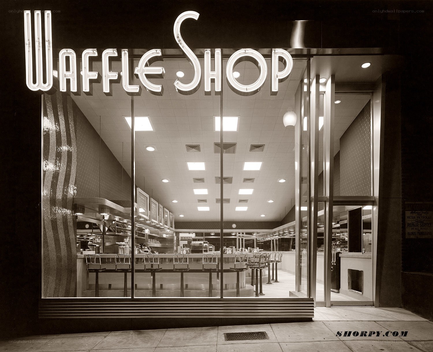 Waffle Shop storefront at night