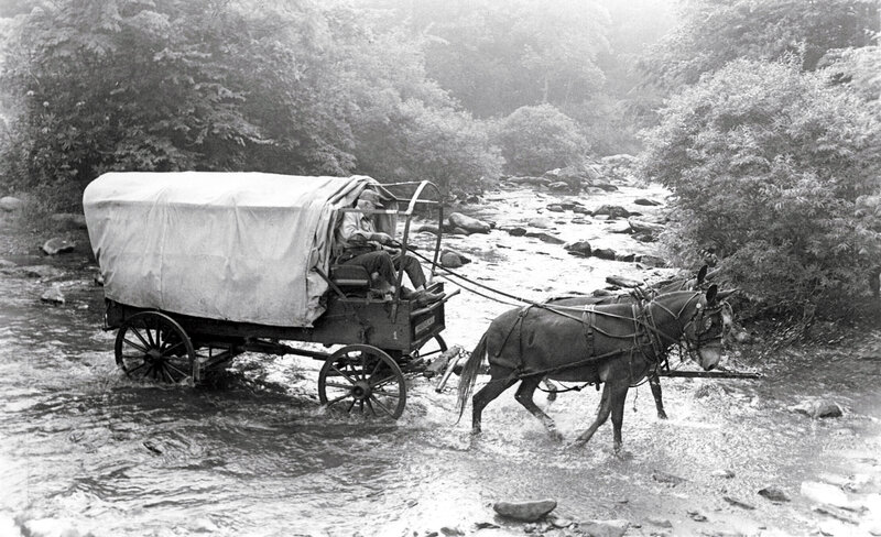 Wagon crossing a river