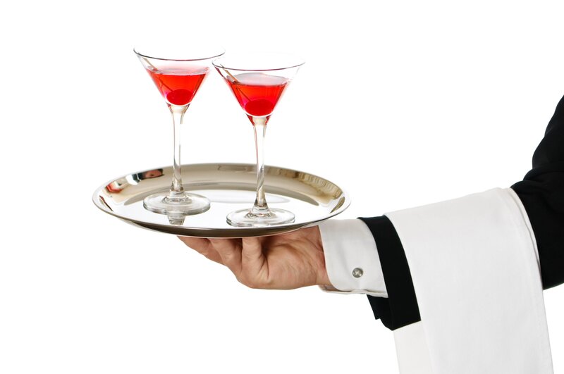 Waiter holding drinks on tray