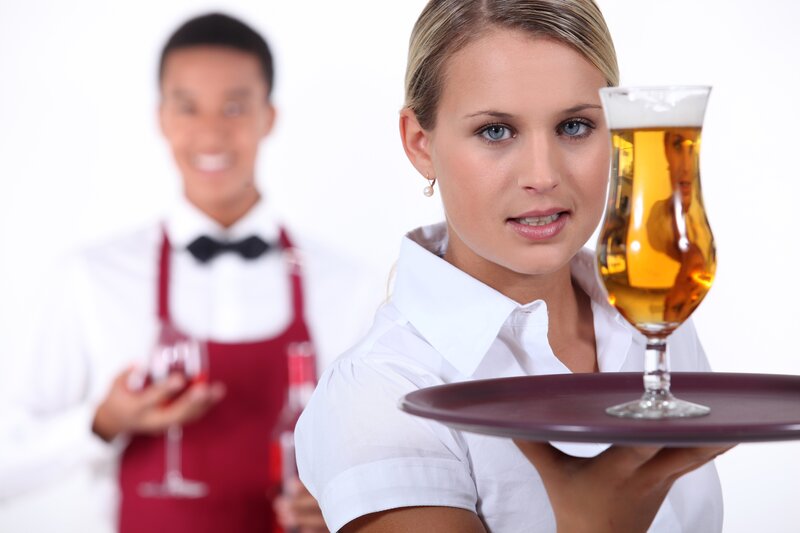 Waitstaff holding drinks