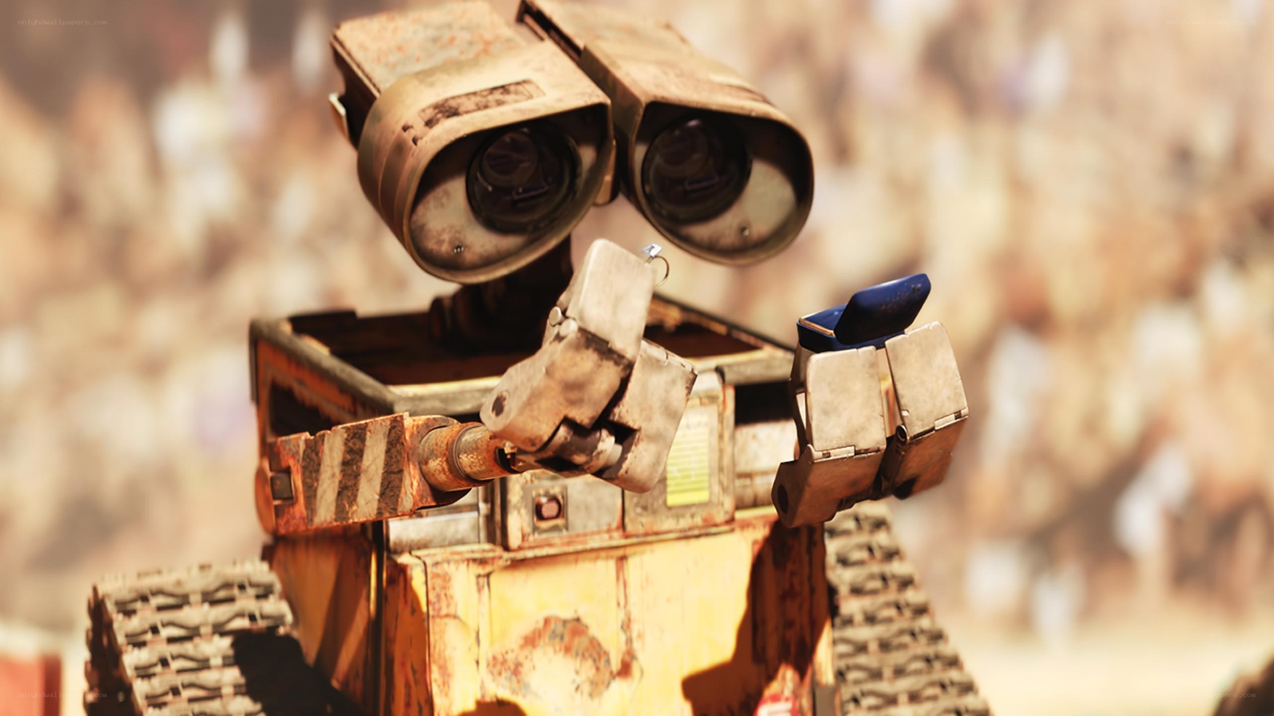 Wall-E holding a ring