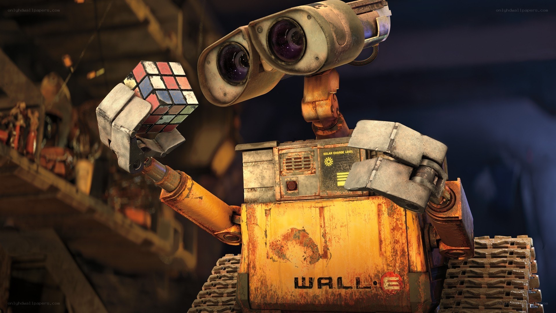 Wall-E holding a Rubik's Cube
