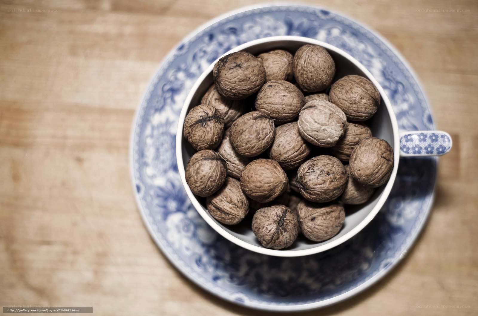 walnuts in a blue and white cup