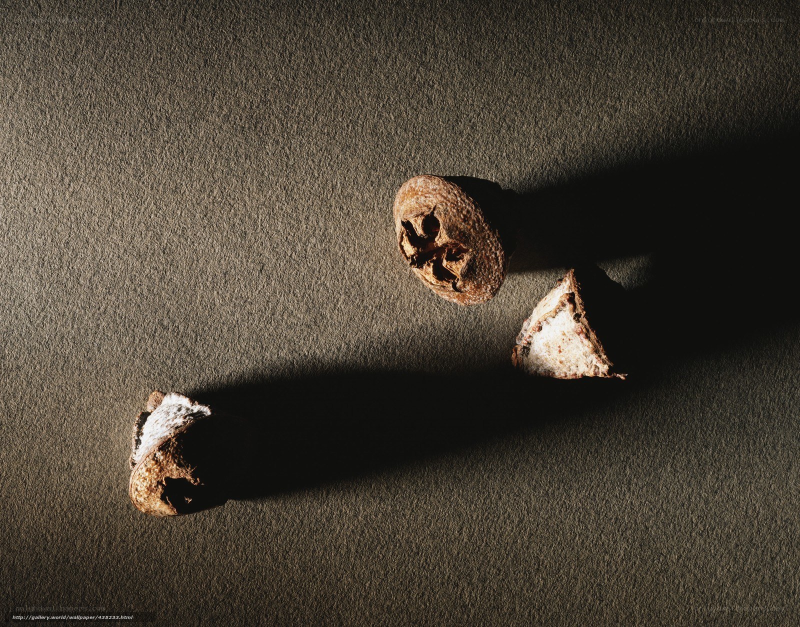 Walnuts on a dark surface