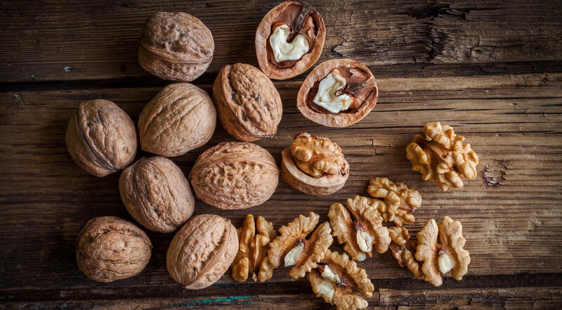 Walnuts on Wooden Surface — Brown, Natural