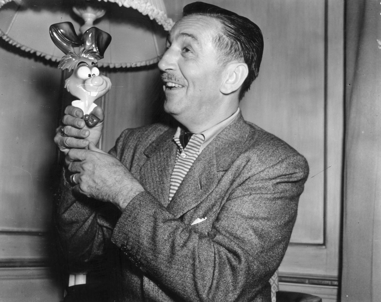 Walt Disney with cartoon figure